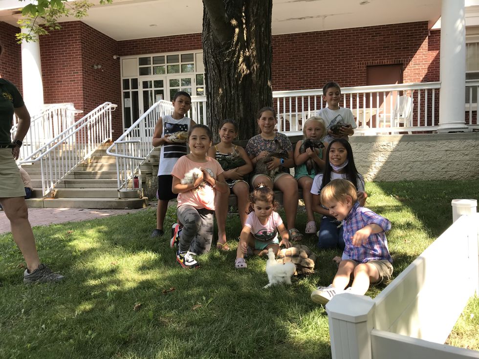 Traveling zoo visits young readers at Millbrook Library