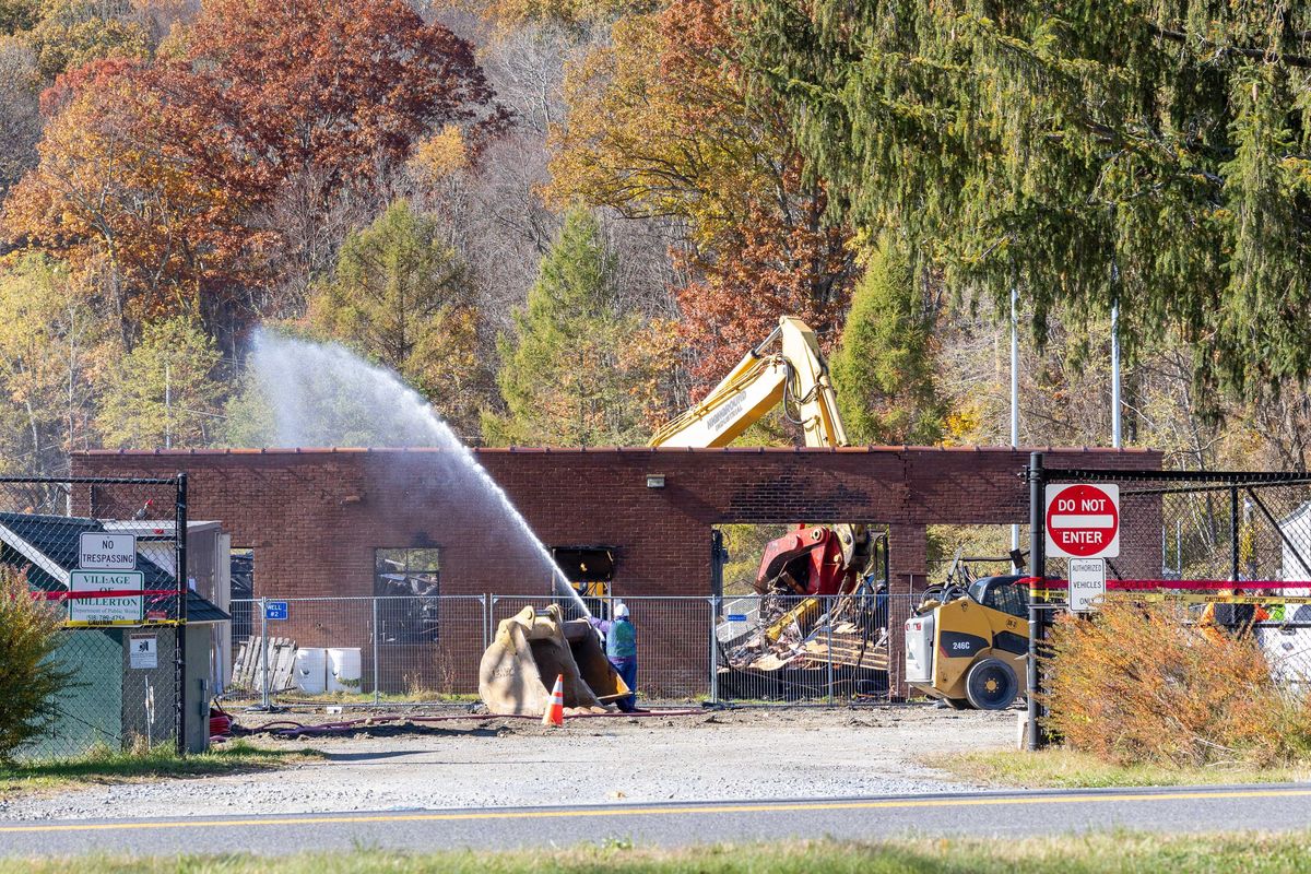 Demolition of Millerton’s fire-damaged highway and water building begins