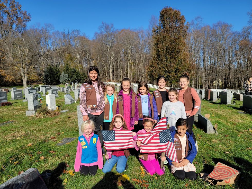 Troops retire flags with reverance