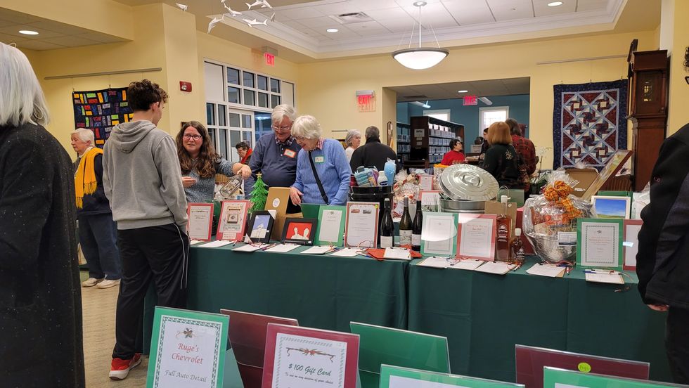 Silent auction nets $13,000 for Millbrook Library