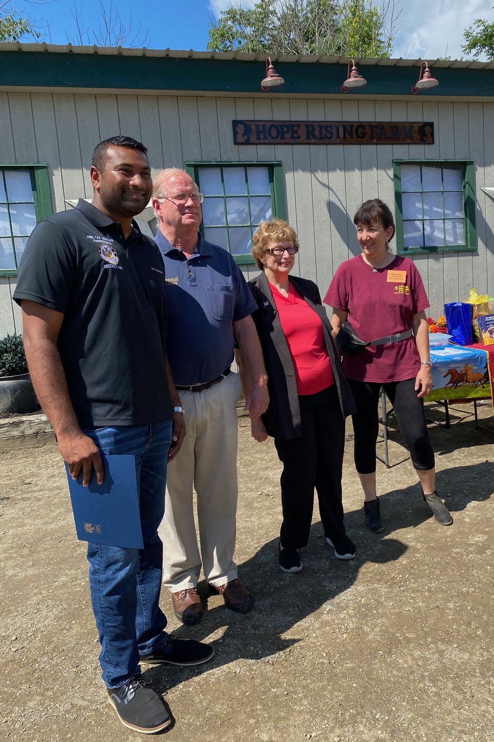 Hope Rising Farm snips a celebratory ribbon at its new Leedsville Road location