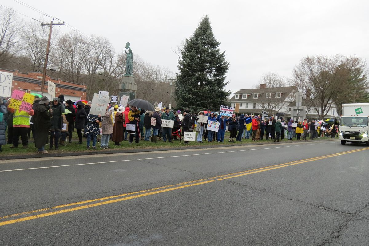 Political protests draw hundreds despite downpour