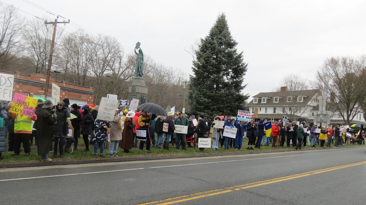 Political protests draw hundreds despite downpour