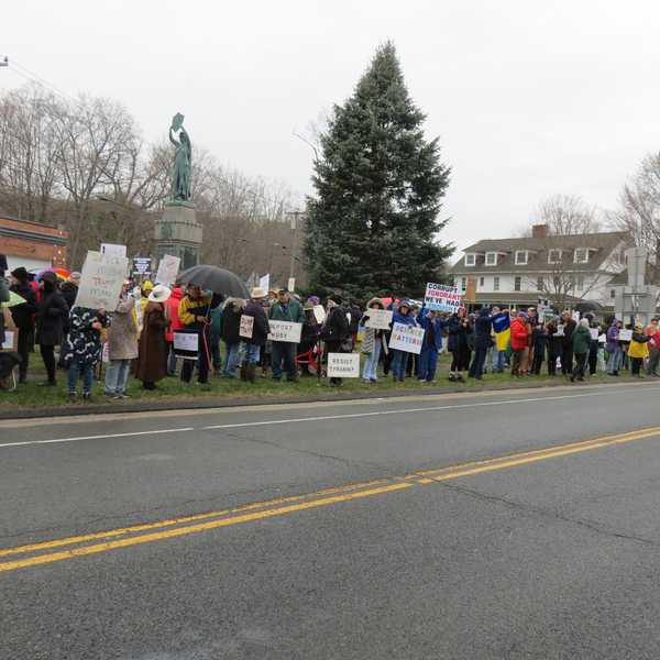 Political protests draw hundreds despite downpour