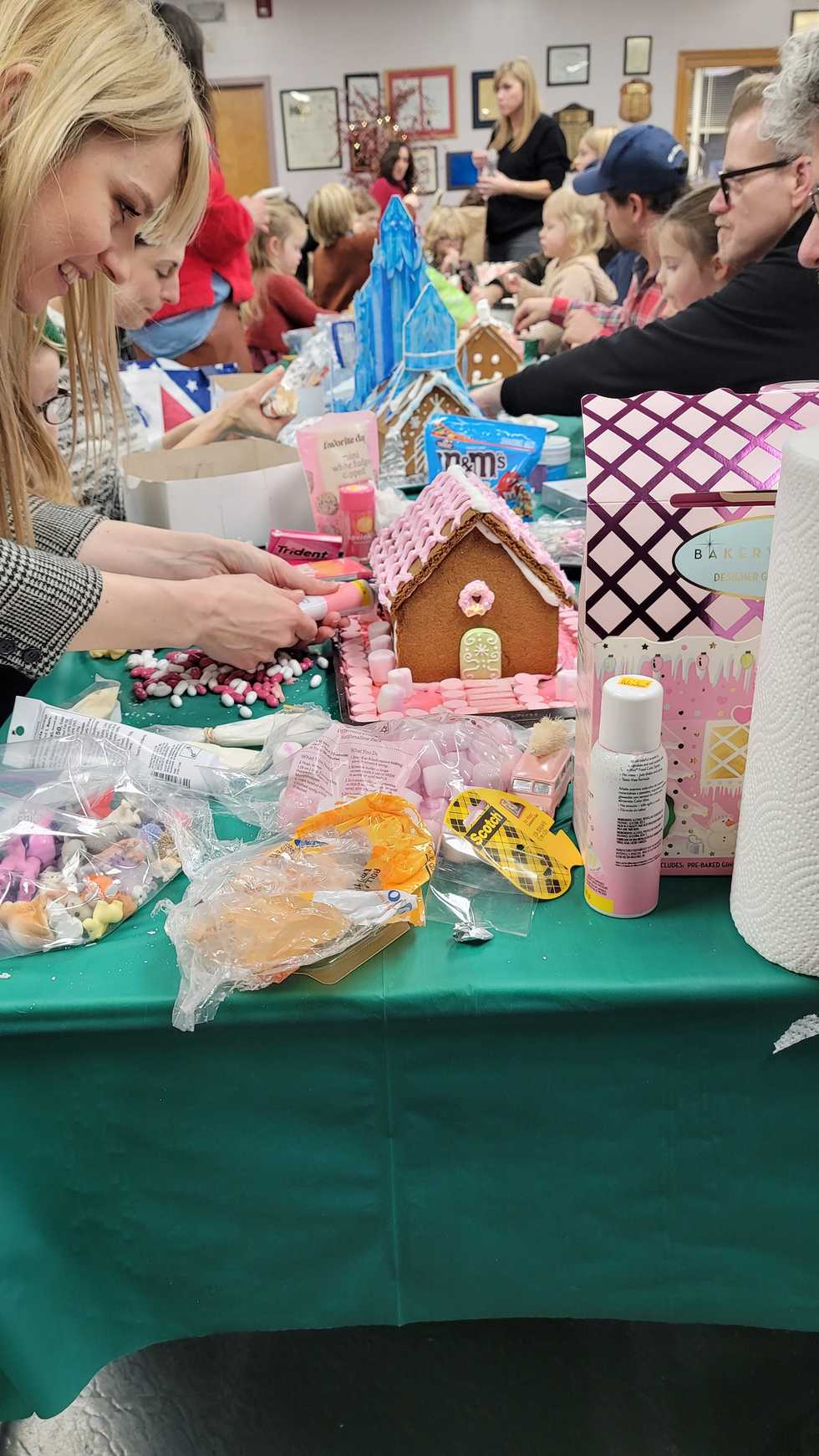 Gingerbread House decorators meet Santa