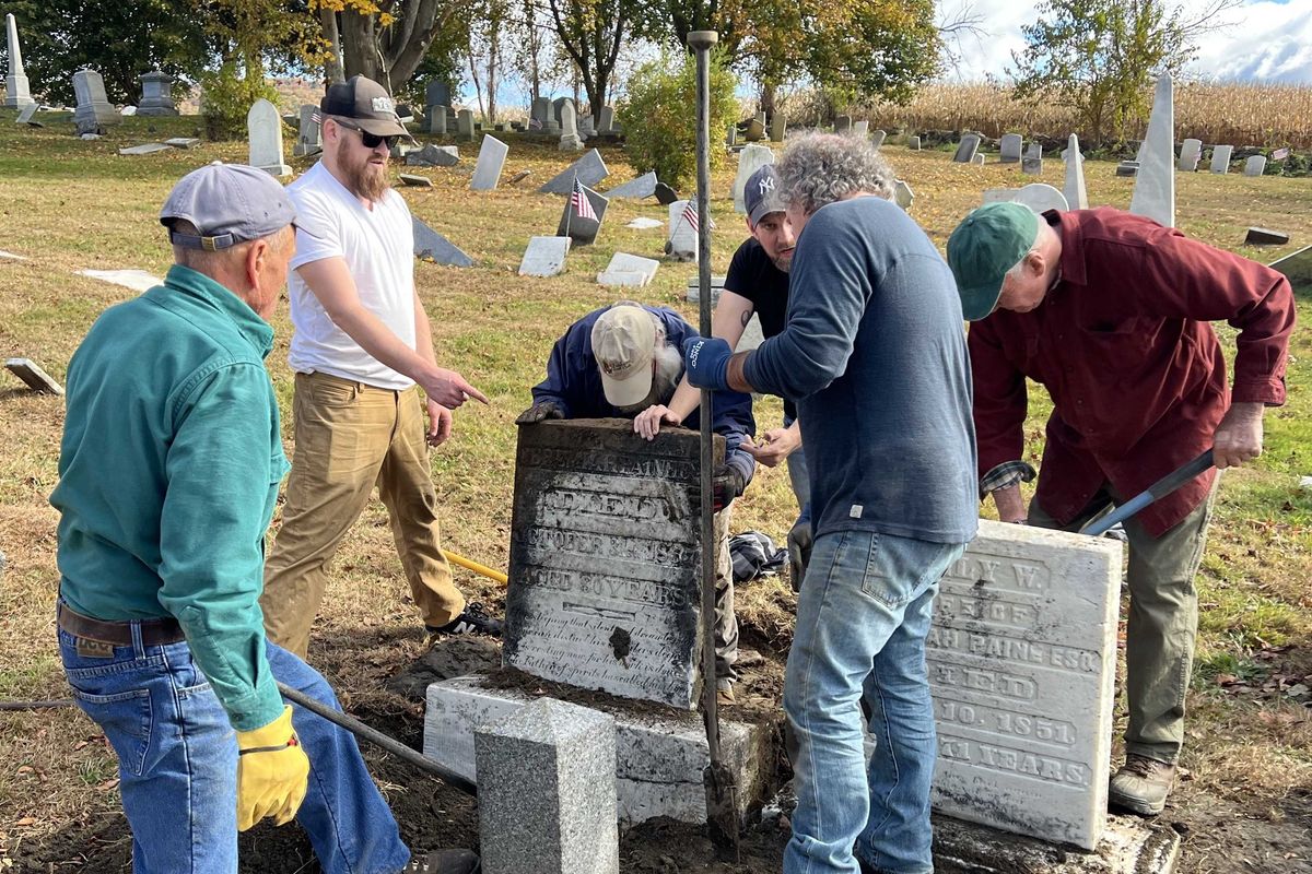 Volunteers lead headstone up-righting effort