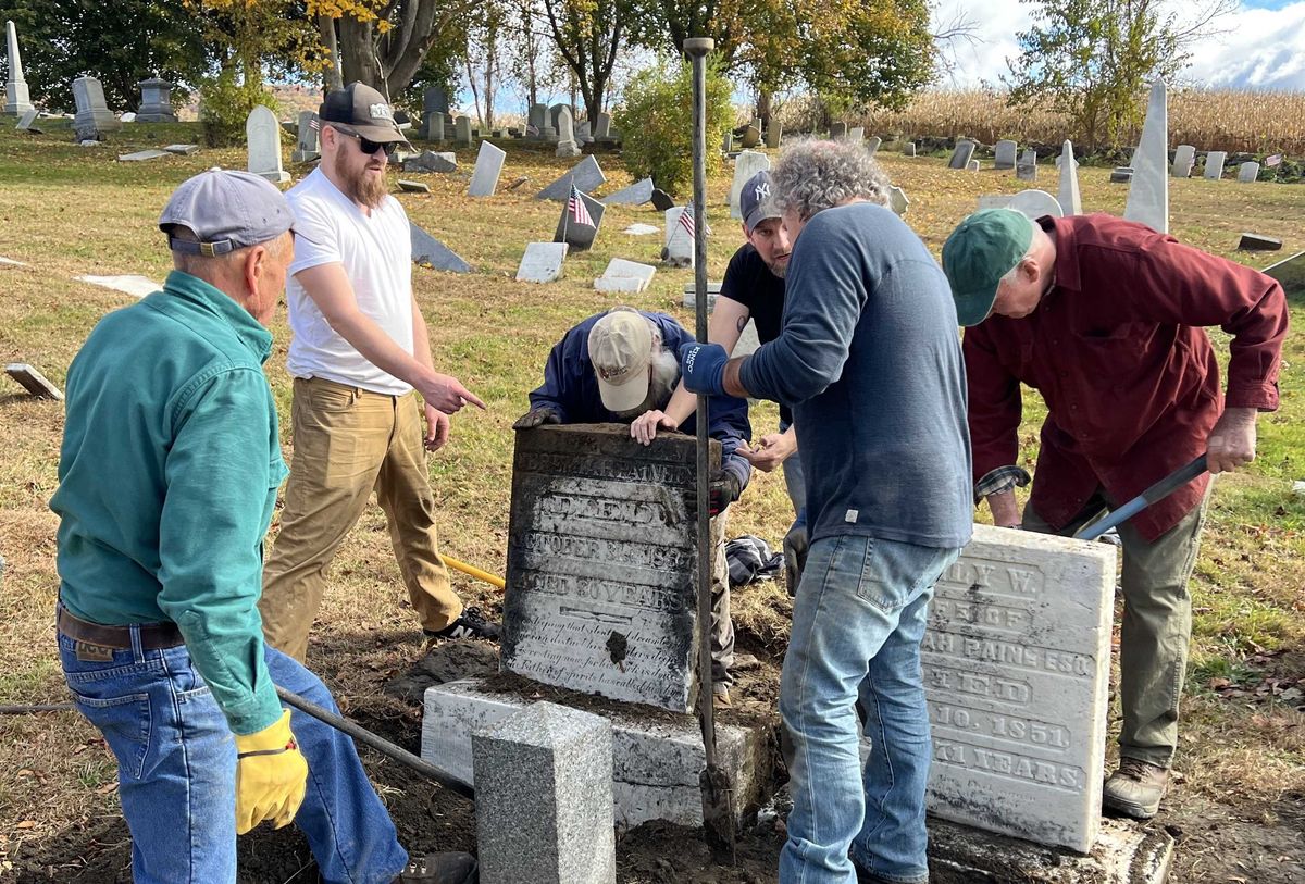 Volunteers lead headstone up-righting effort