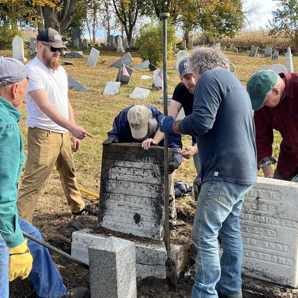 Volunteers lead headstone up-righting effort